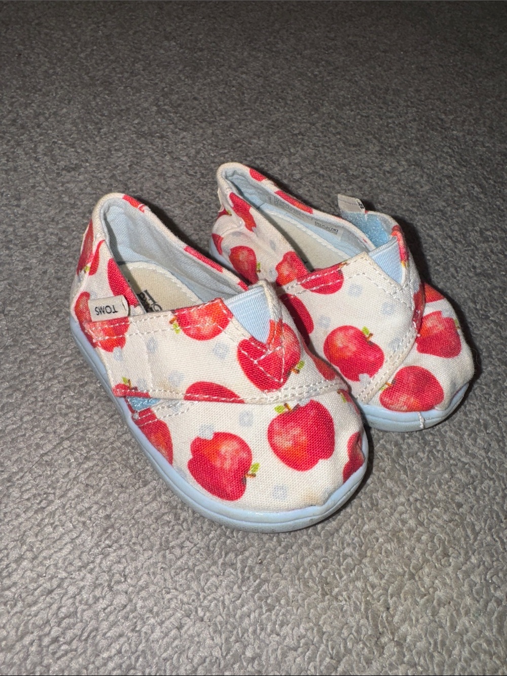 Toms Kids Slip-On Shoes in White with Red Apple Print